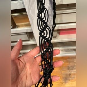 Black vinyl lace belt